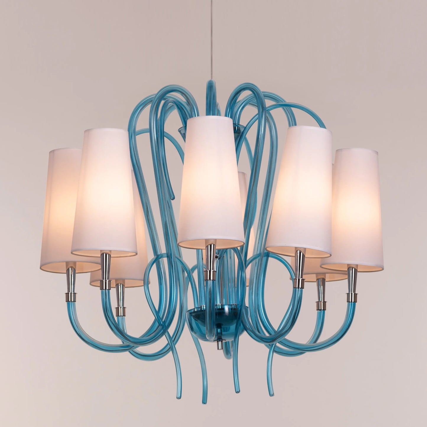 Lunch In London blue and white glass chandelier illuminating an elegant dining room