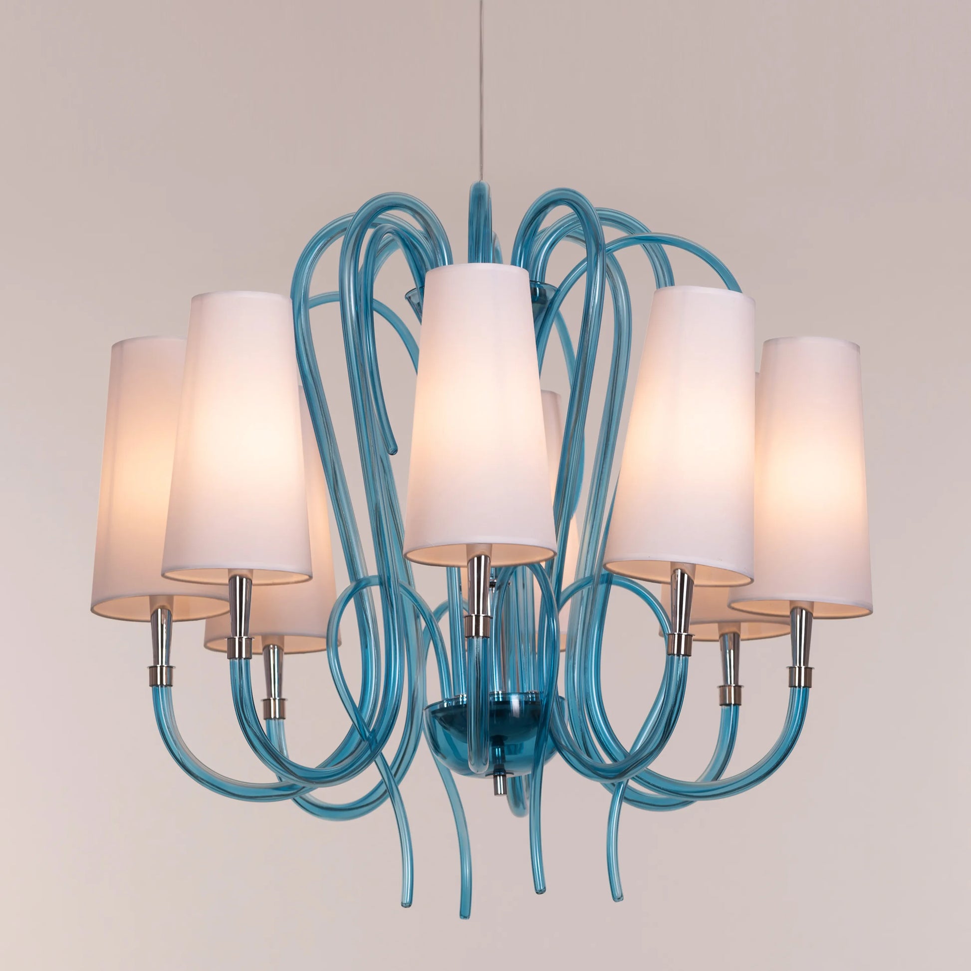 Lunch In London blue and white glass chandelier illuminating an elegant dining room