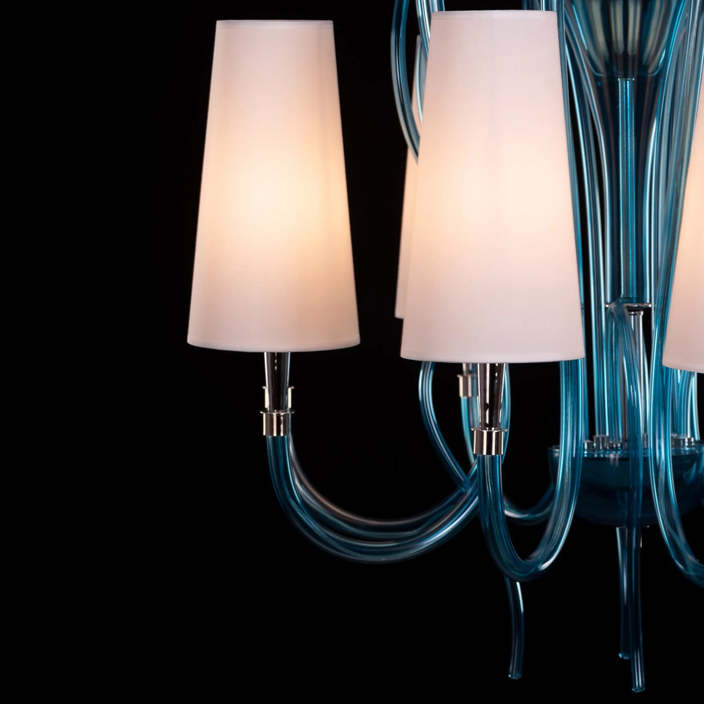 Lunch In London blue and white glass chandelier illuminating an elegant dining room