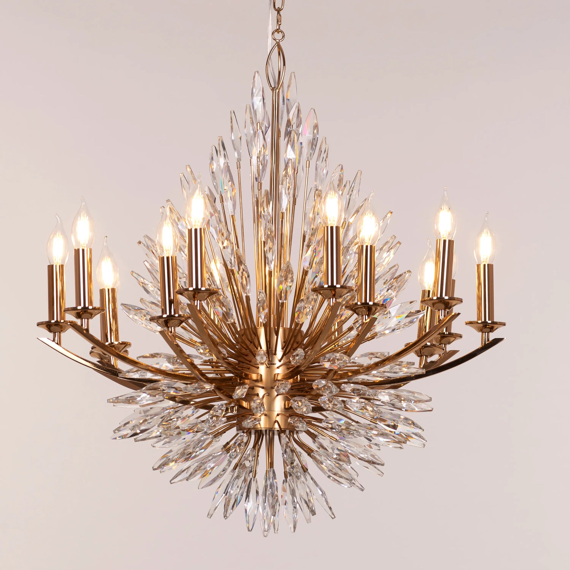 Jewel Of My Heart gold and crystal chandelier illuminating a luxurious master bedroom with its warm, romantic glow