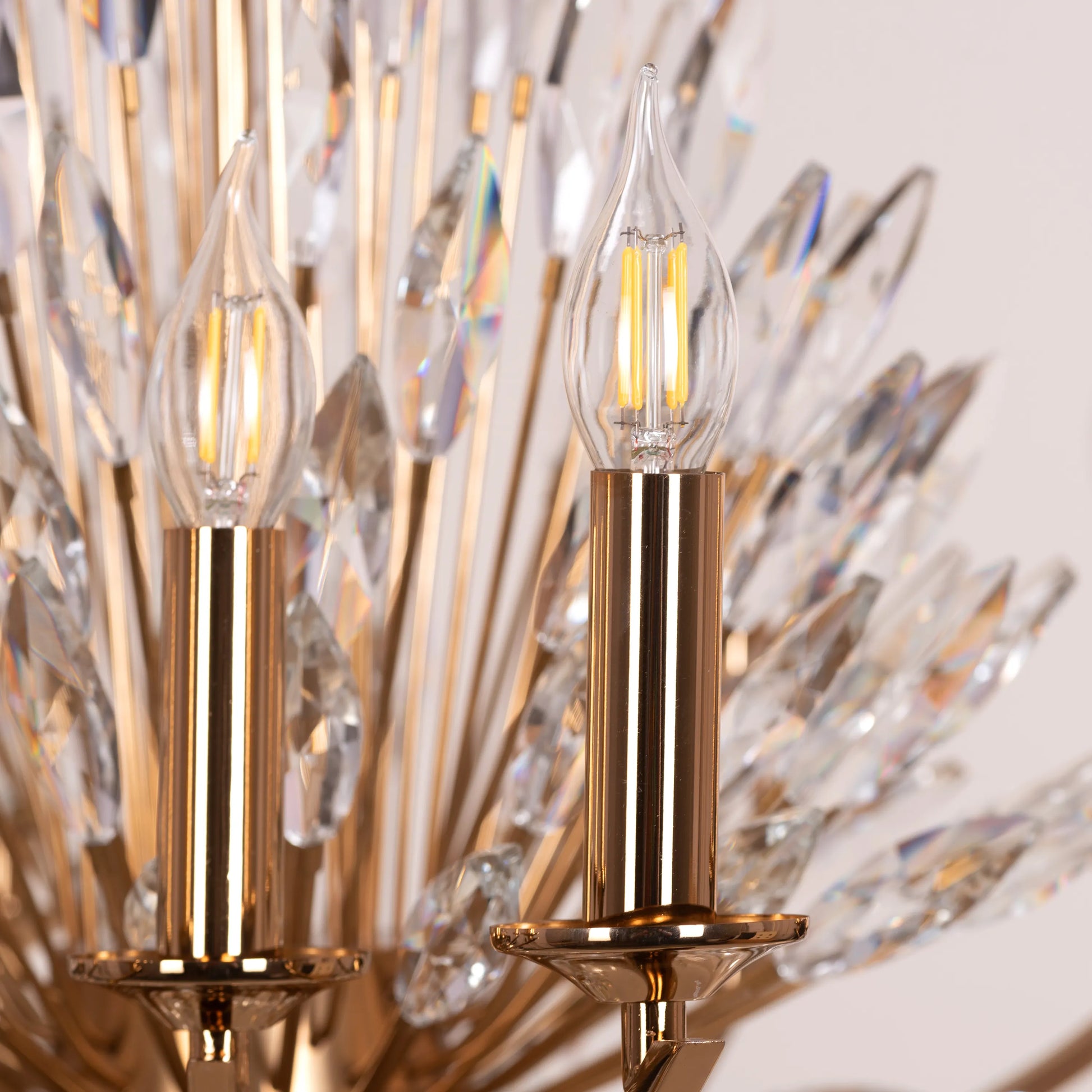 Jewel Of My Heart gold and crystal chandelier illuminating a luxurious master bedroom with its warm, romantic glow