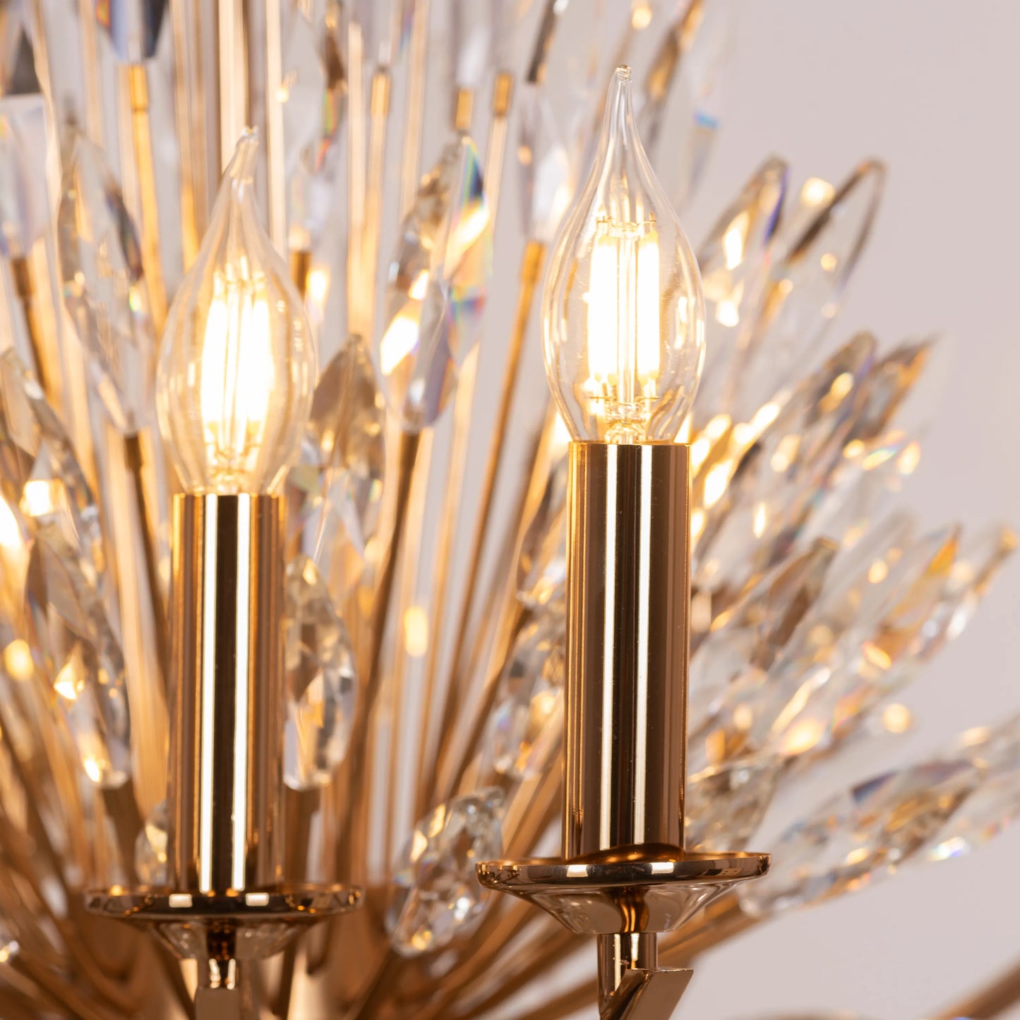 Jewel Of My Heart gold and crystal chandelier illuminating a luxurious master bedroom with its warm, romantic glow