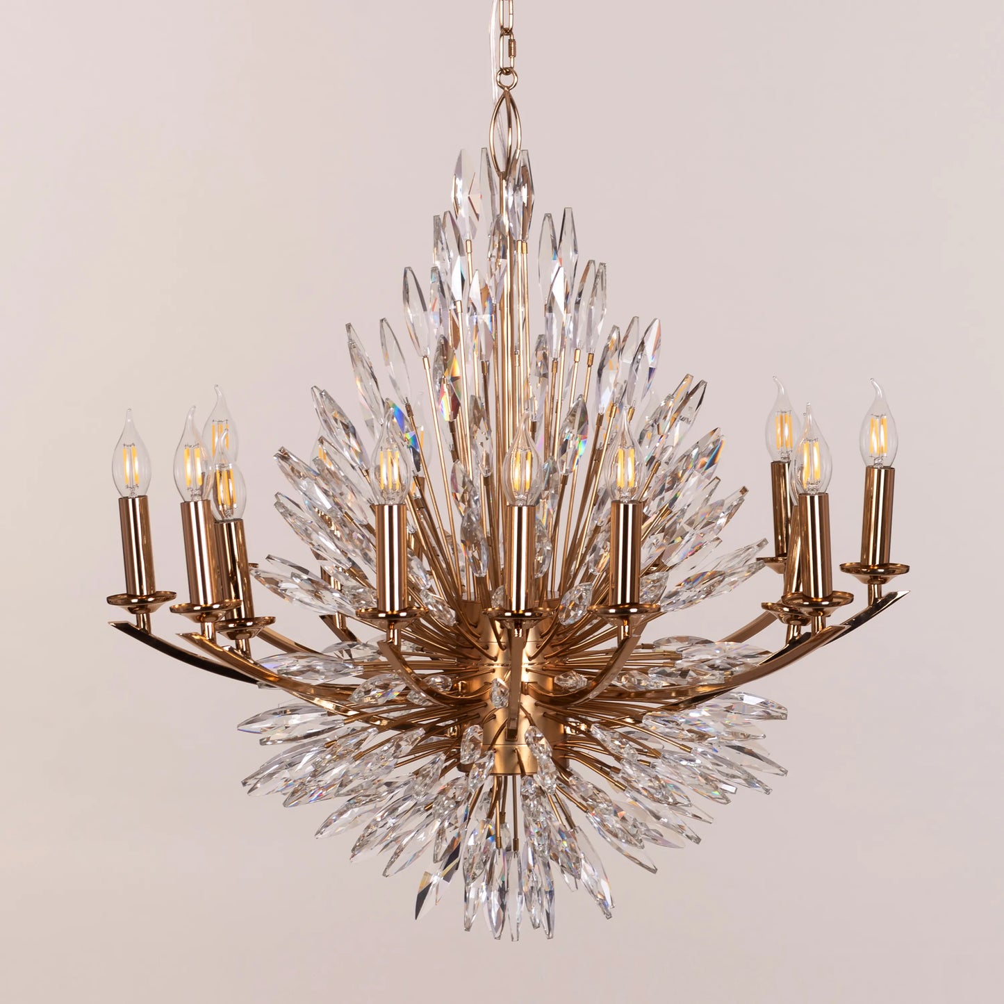 Jewel Of My Heart gold and crystal chandelier illuminating a luxurious master bedroom with its warm, romantic glow