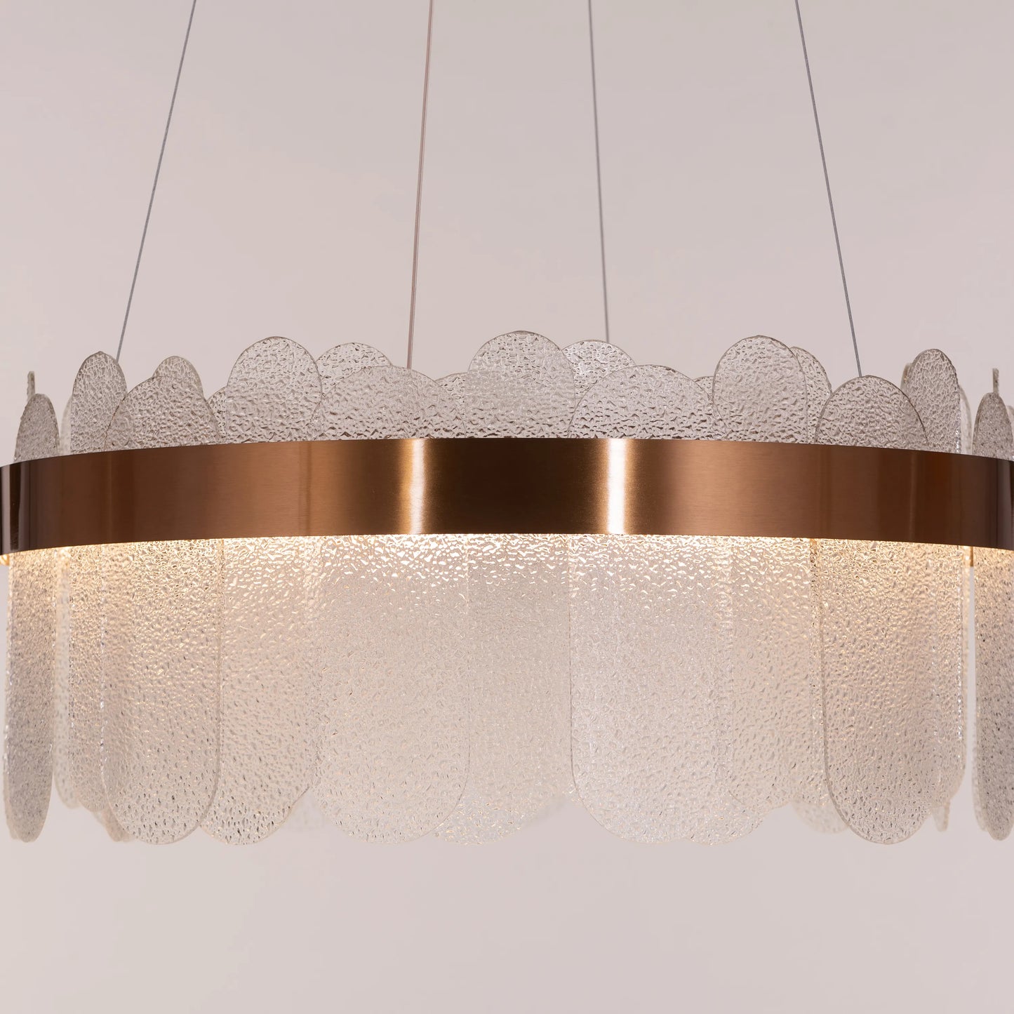 Join The Party Round Glass Chandelier hanging in a modern dining room.