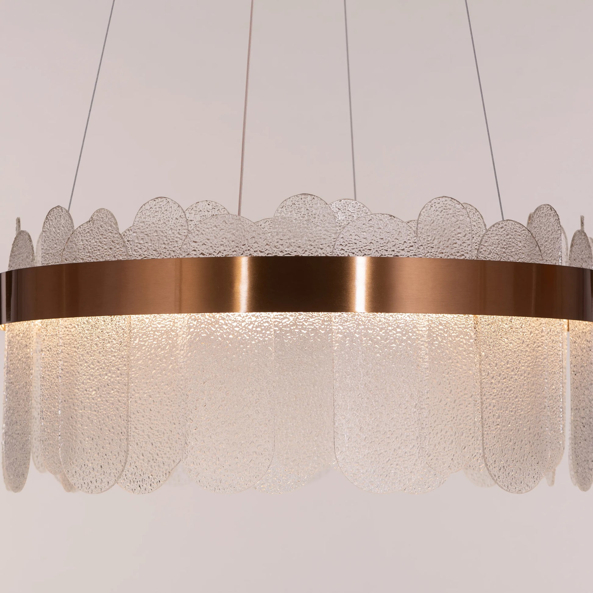 Join The Party Round Glass Chandelier hanging in a modern dining room.