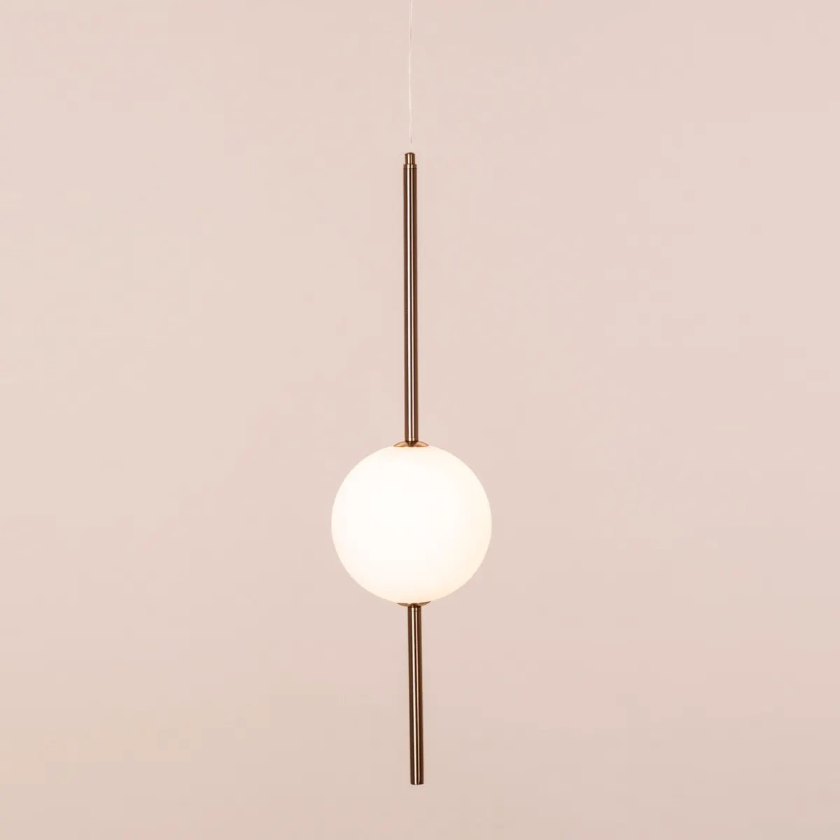 A modern pendant light named 'Peacemaker,' featuring a sleek gold finish and built-in LED lighting. The minimalist design showcases clean lines and a refined silhouette, while the integrated LED provides bright, energy-efficient illumination. This elegant pendant adds a touch of sophistication and warmth to any space, making it a perfect addition to contemporary decor