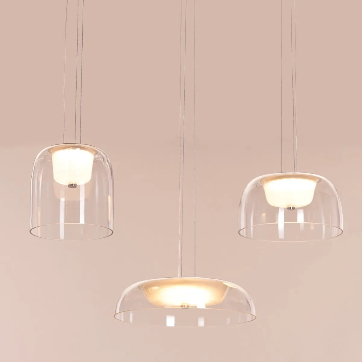 Love Spell Glass Chandelier casting a romantic glow in an elegant dining room.