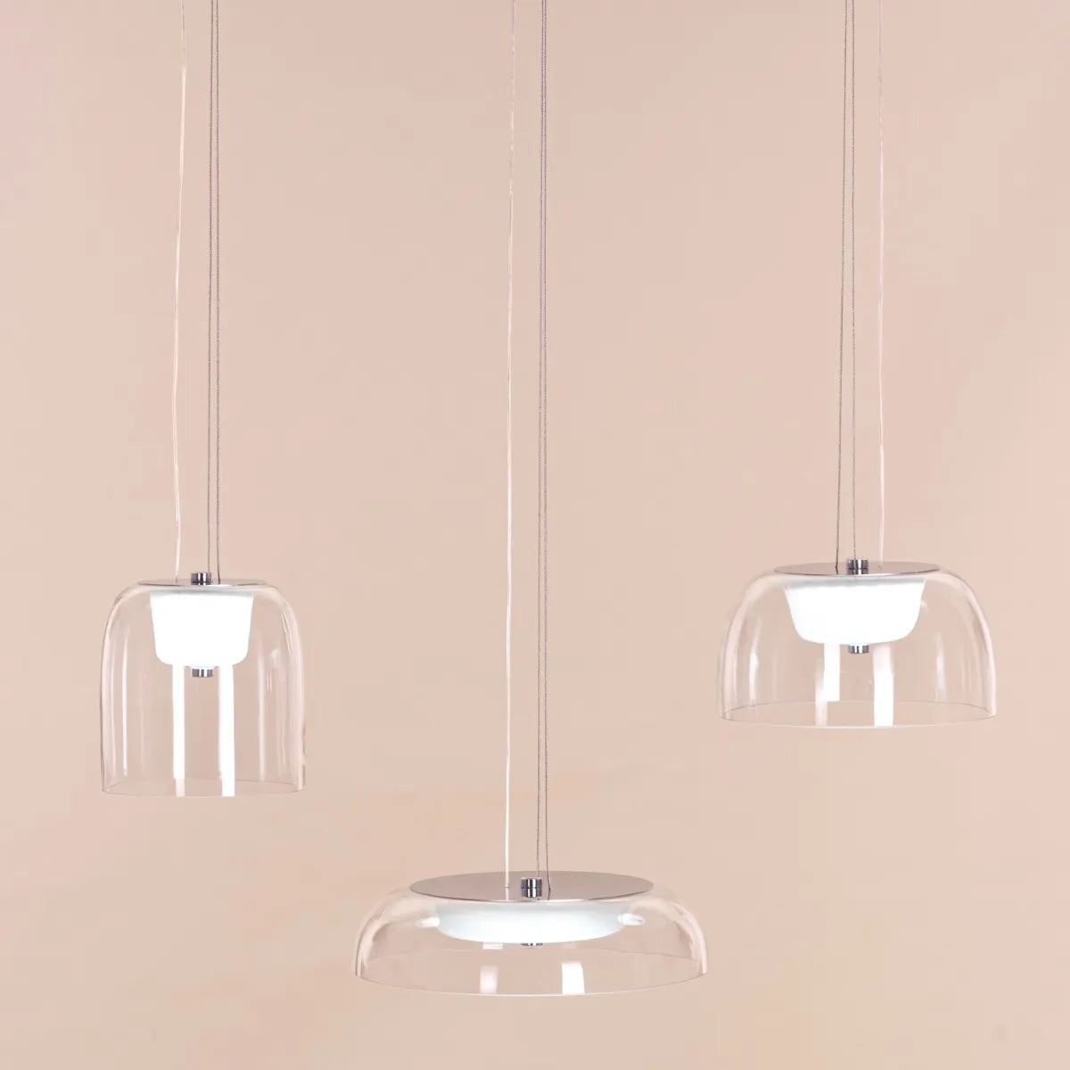 Love Spell Glass Chandelier casting a romantic glow in an elegant dining room.