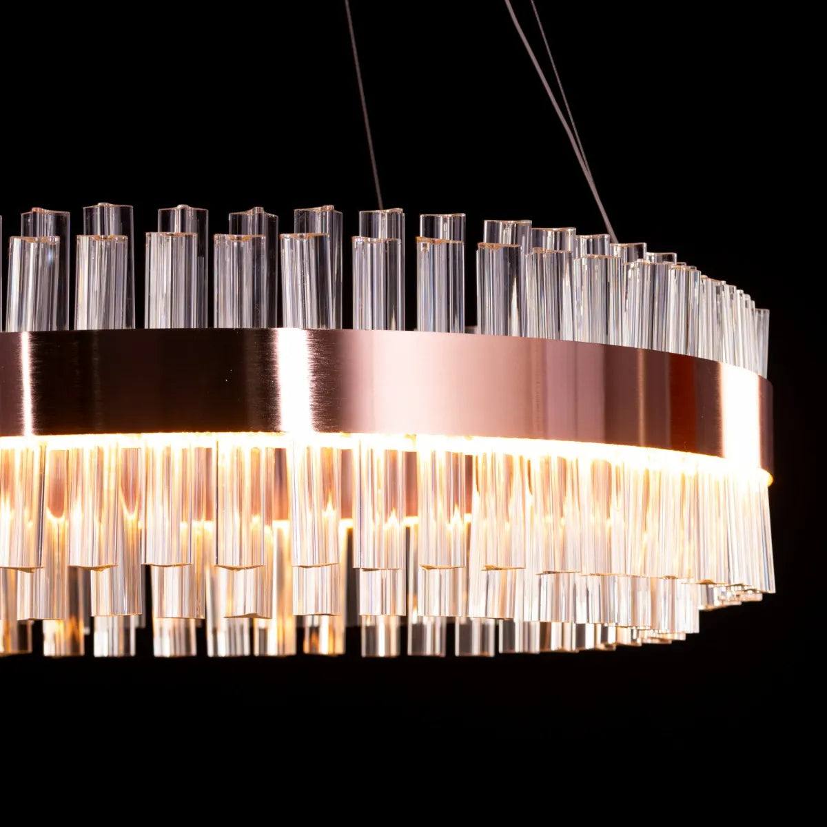 Lighting Up Lisbon Crystal Chandelier illuminating a stylish dining room.