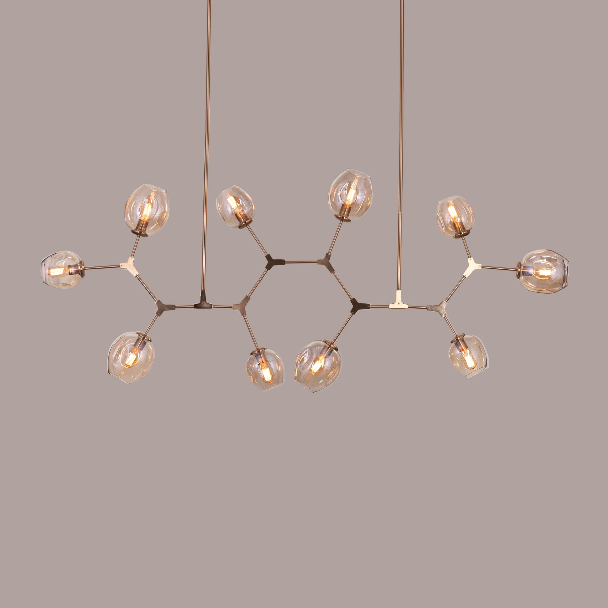 Games People Play Cognac Glass Chandelier with elegant glass shades.