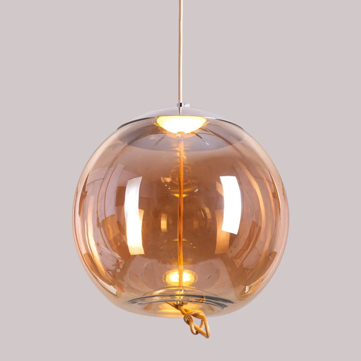 Sophisticated Motivation Pendant Light Featuring Beautiful Amber Glass and Smart Built-In LED