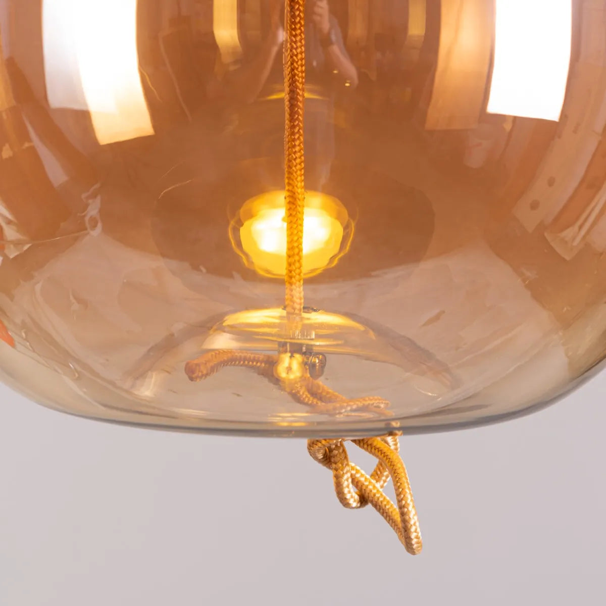 Sophisticated Motivation Pendant Light Featuring Beautiful Amber Glass and Smart Built-In LED