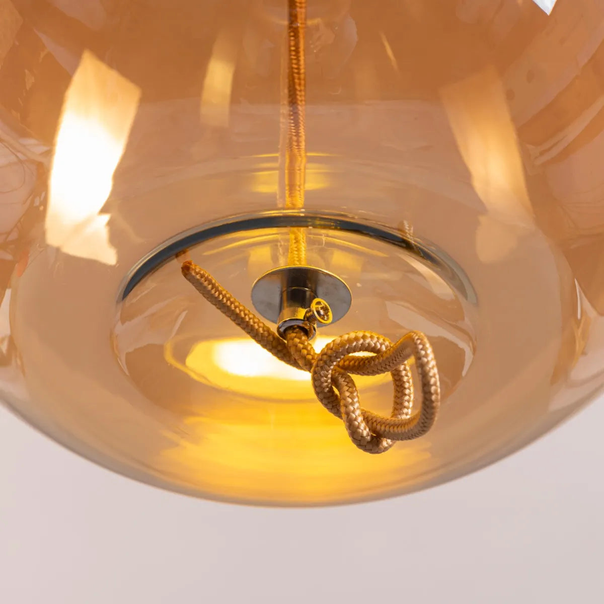 Sophisticated Motivation Pendant Light Featuring Beautiful Amber Glass and Smart Built-In LED