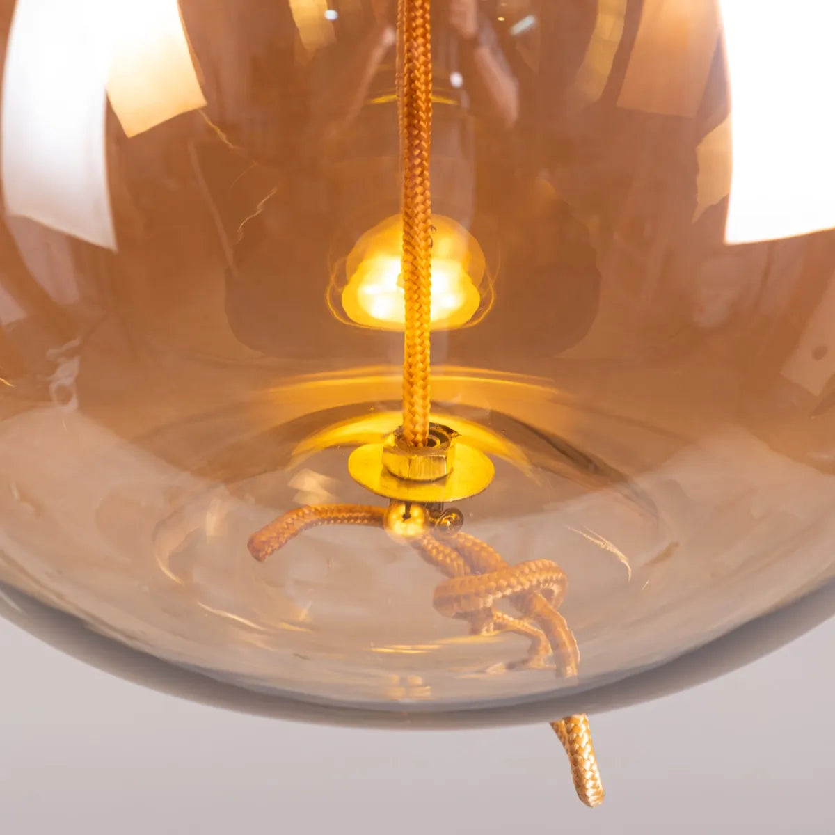 Sophisticated Motivation Pendant Light Featuring Beautiful Amber Glass and Smart Built-In LED