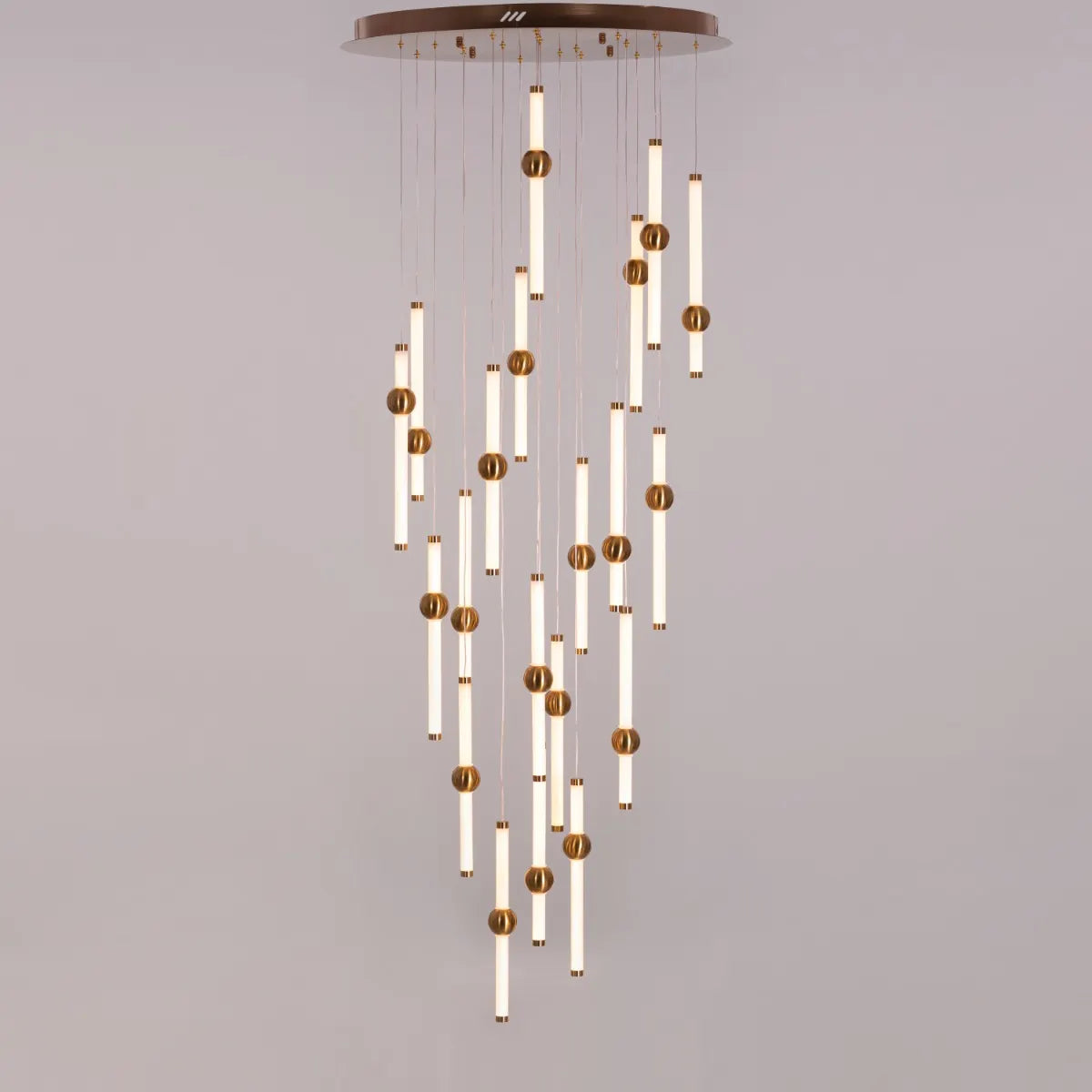 Left On Read double height glass chandelier illuminating a spacious living room