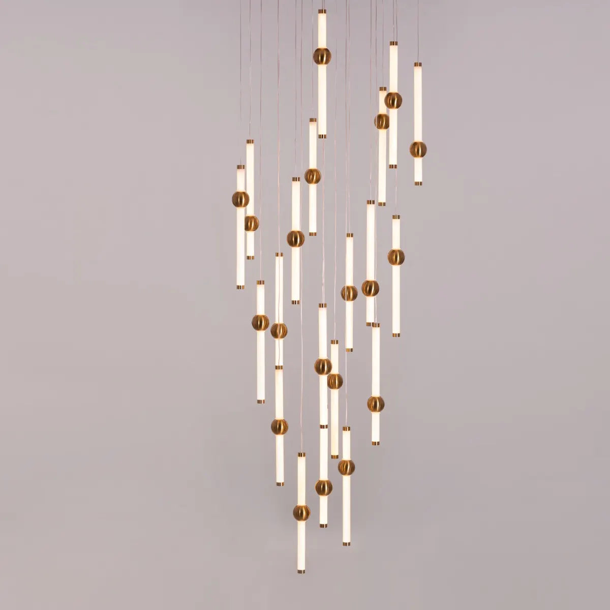 Left On Read double height glass chandelier illuminating a spacious living room