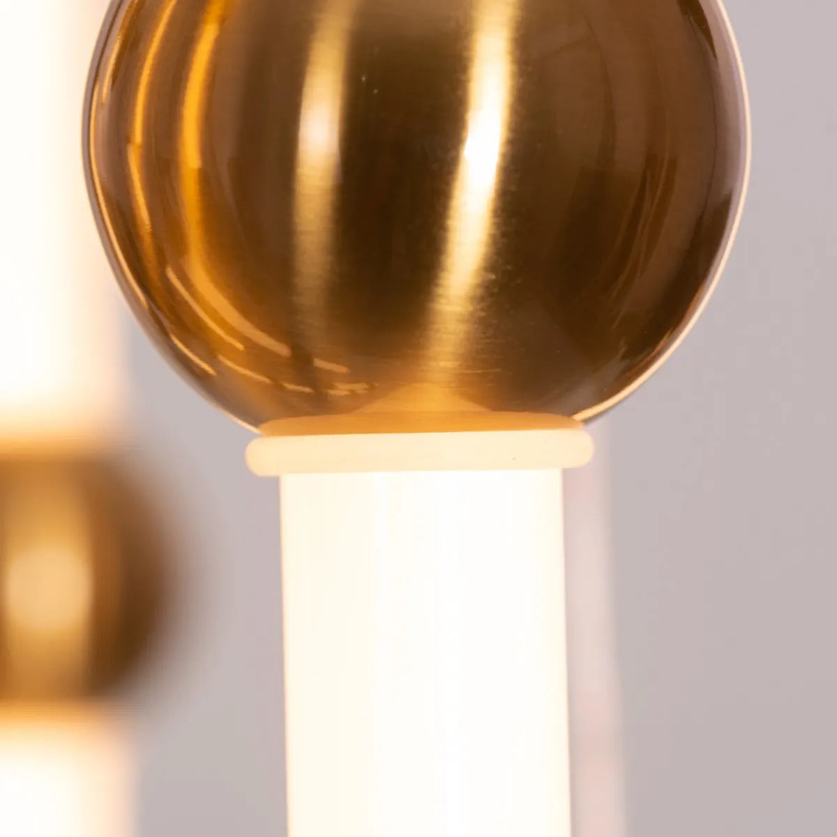 Left On Read double height glass chandelier illuminating a spacious living room