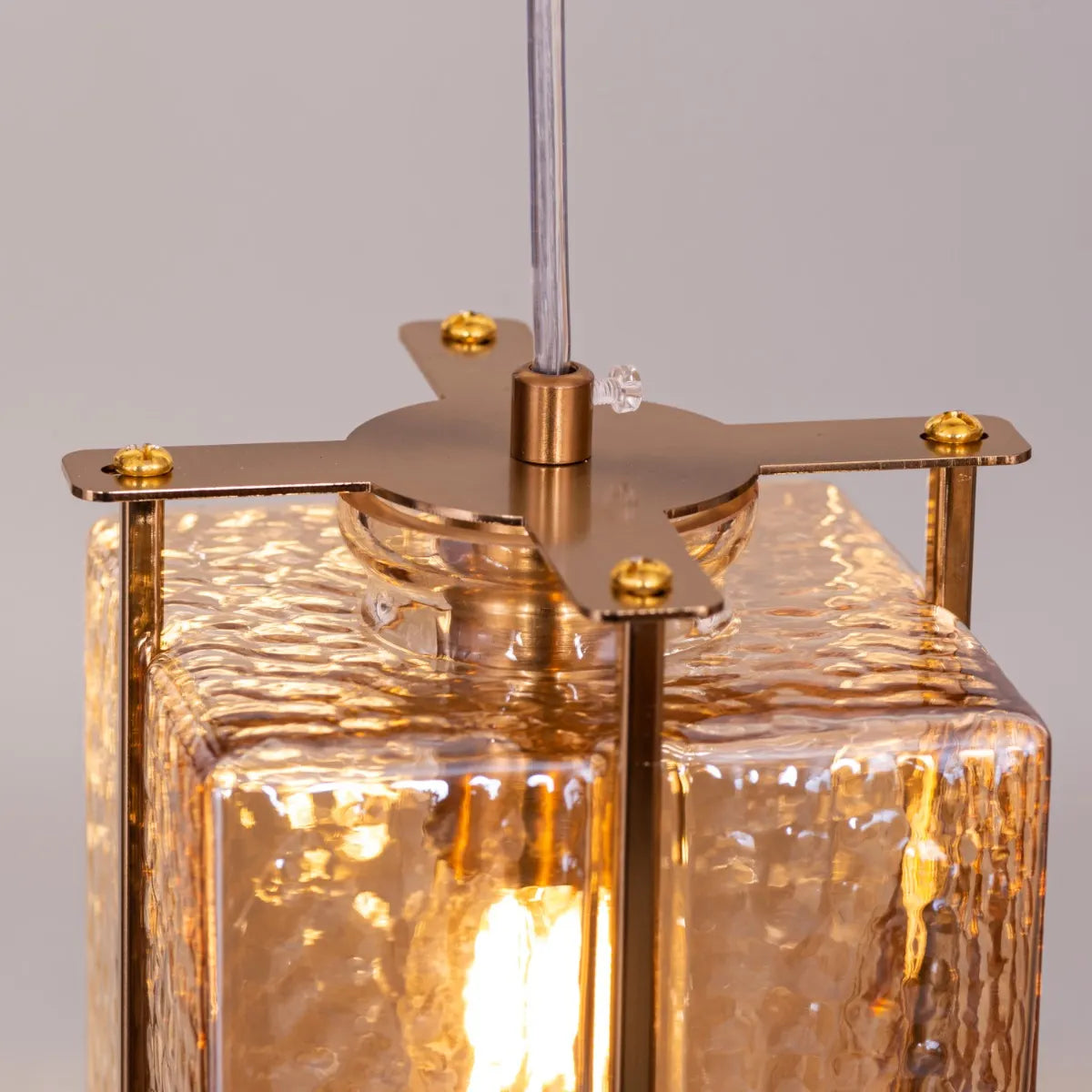 Take The Leap Textured Glass Chandelier illuminating a modern living room.