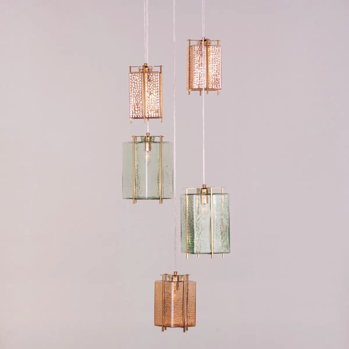 Take The Leap Textured Glass Chandelier illuminating a modern living room.