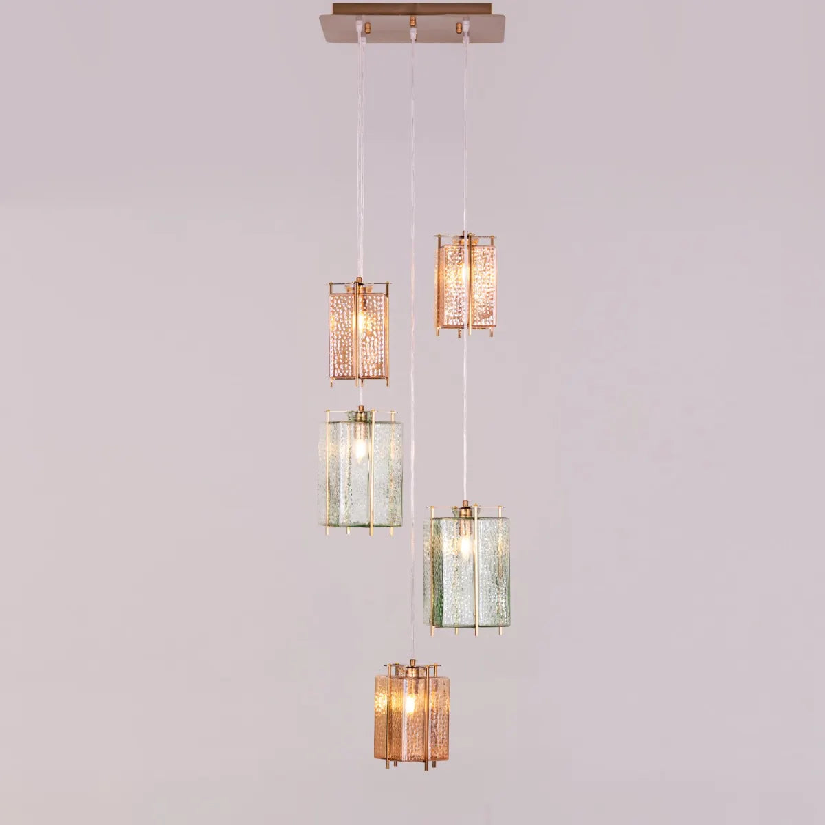 Take The Leap Textured Glass Chandelier illuminating a modern living room.