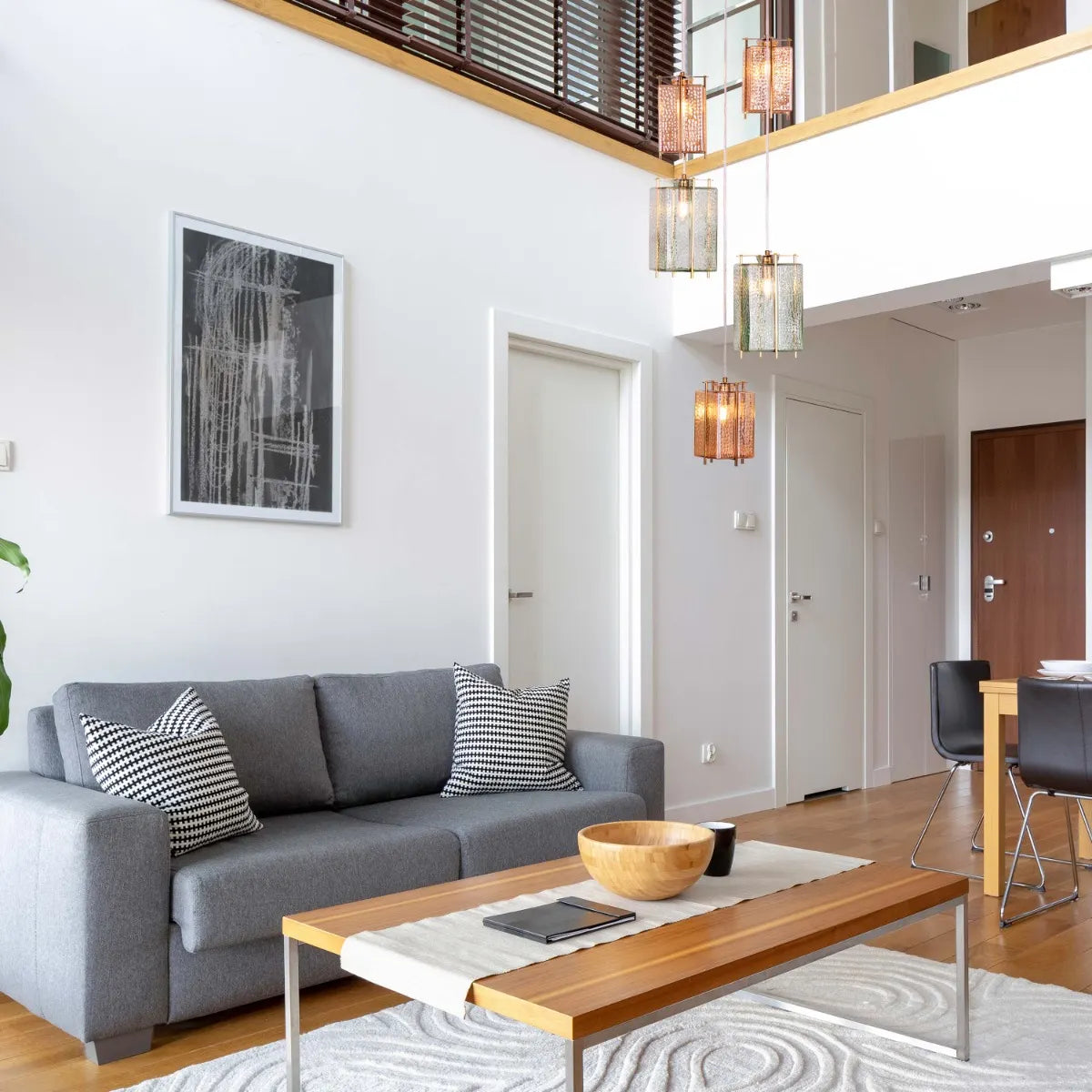 Take The Leap Textured Glass Chandelier illuminating a modern living room.