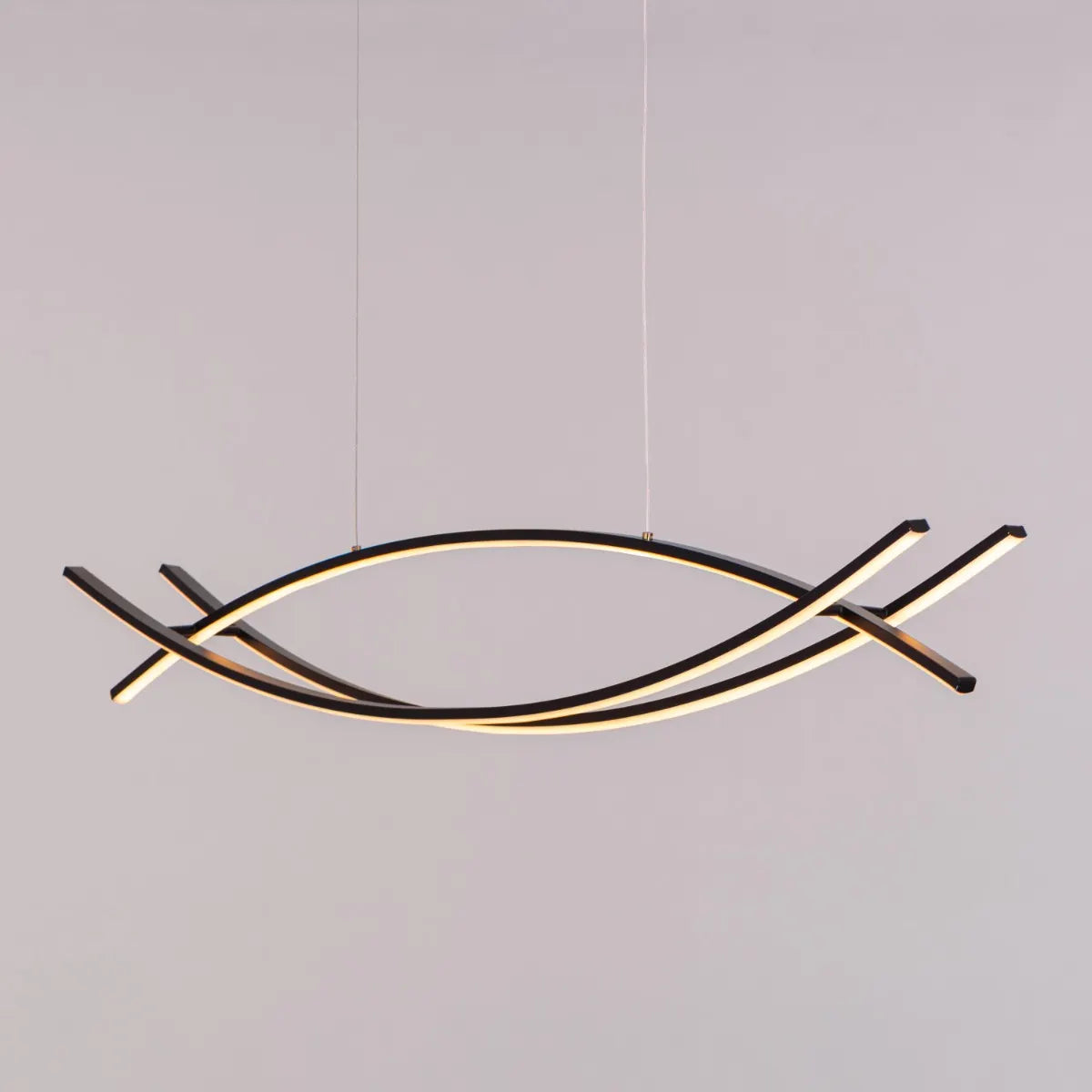 Believe In Me Chandelier suspended in a home office, its striking black elements contrasting with warm white light, creating an inspiring workspace.