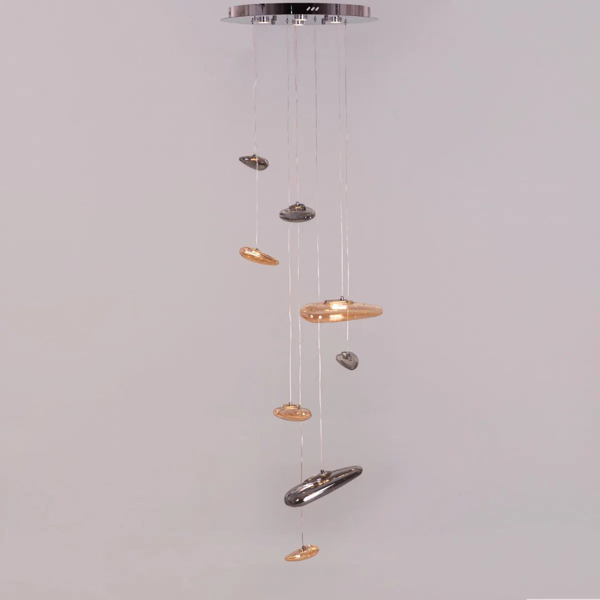 Raise Your Glass Double Height Glass Chandelier illuminating a grand foyer.