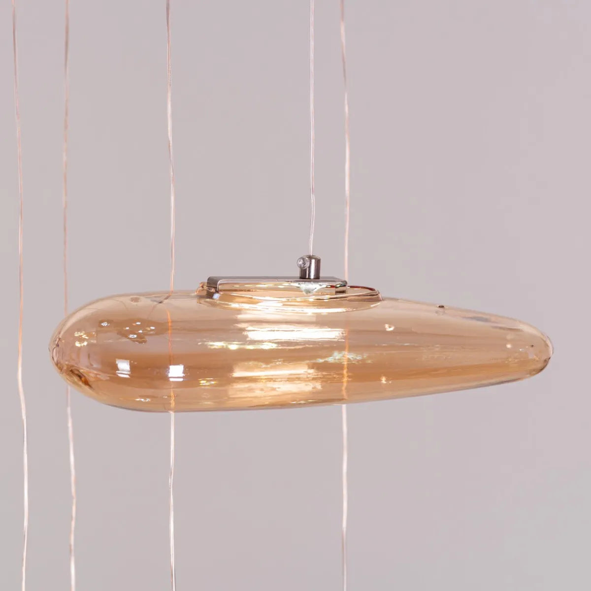 Raise Your Glass Double Height Glass Chandelier illuminating a grand foyer.