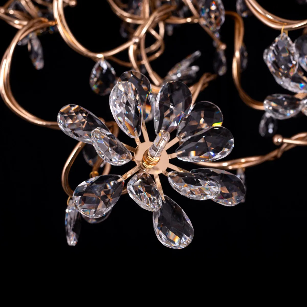 Large gold crystal chandelier with multiple tiers of cascading crystals