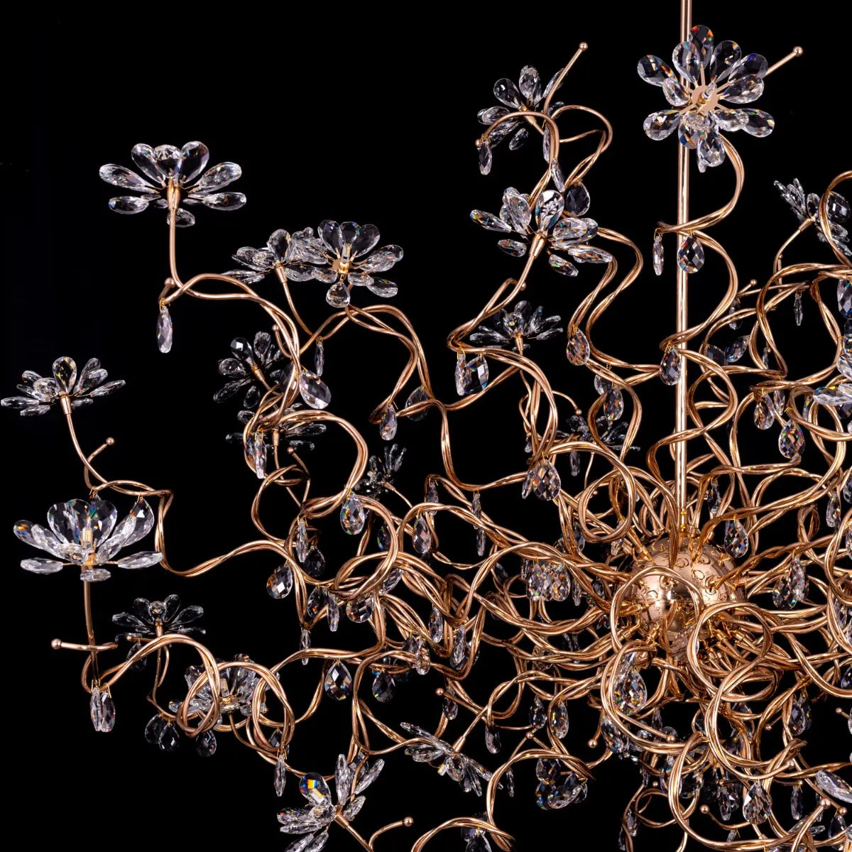 Large gold crystal chandelier with multiple tiers of cascading crystals