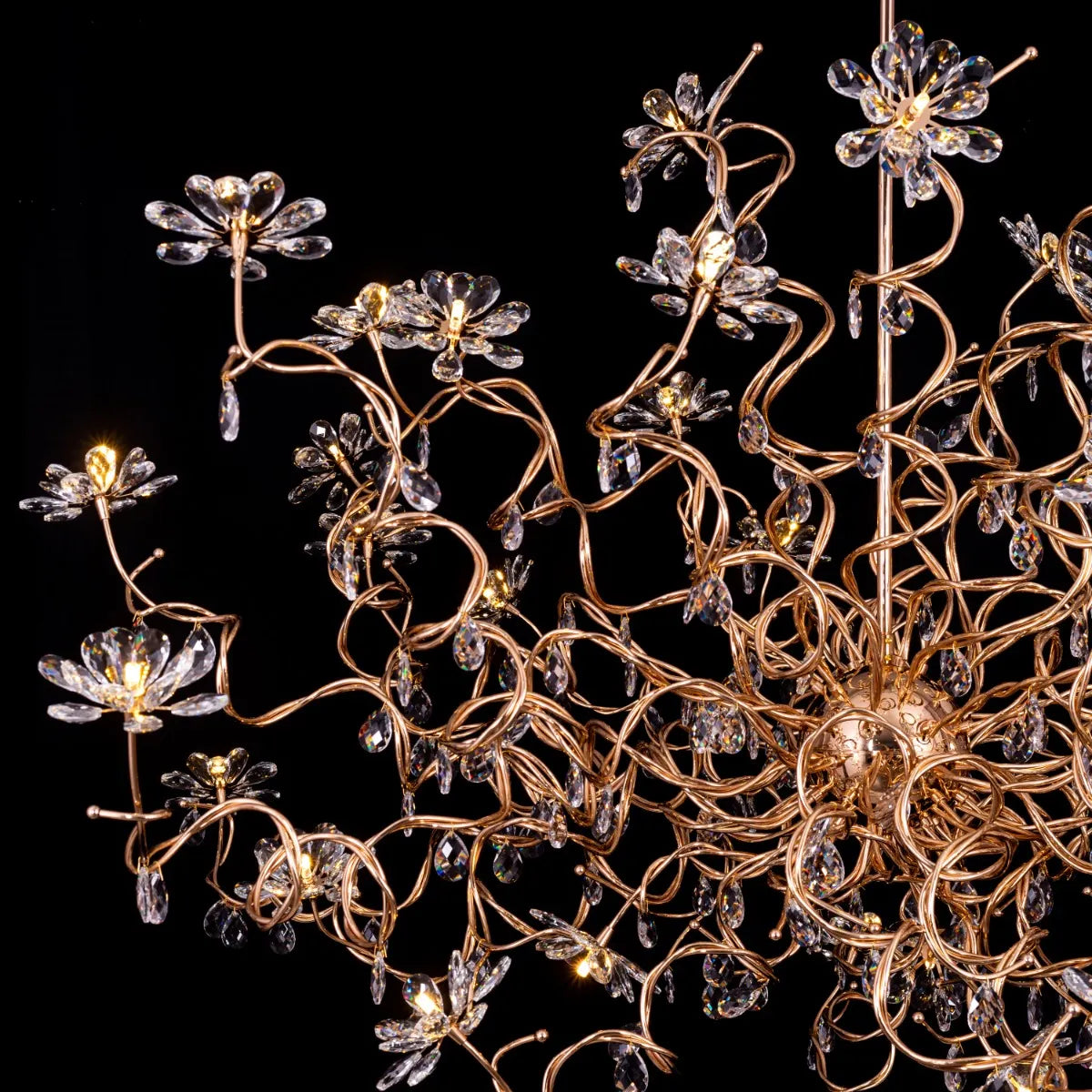 Large gold crystal chandelier with multiple tiers of cascading crystals