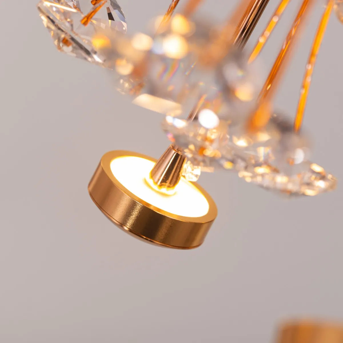 Soaring Signature crystal chandelier illuminating a grand, open-concept living space