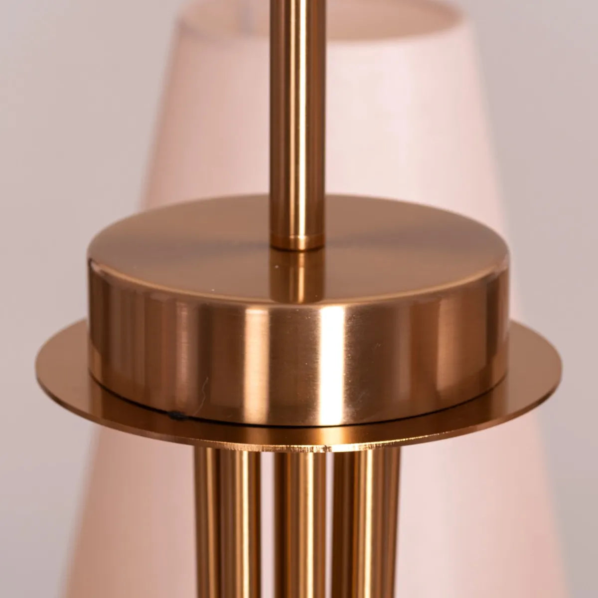 Large gold and beige fabric chandelier with layered shades resembling fluttering pages