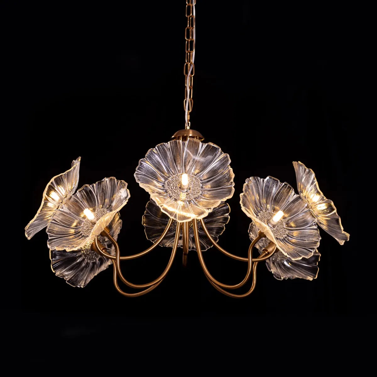 Late For Reality large gold chandelier with glass elements.