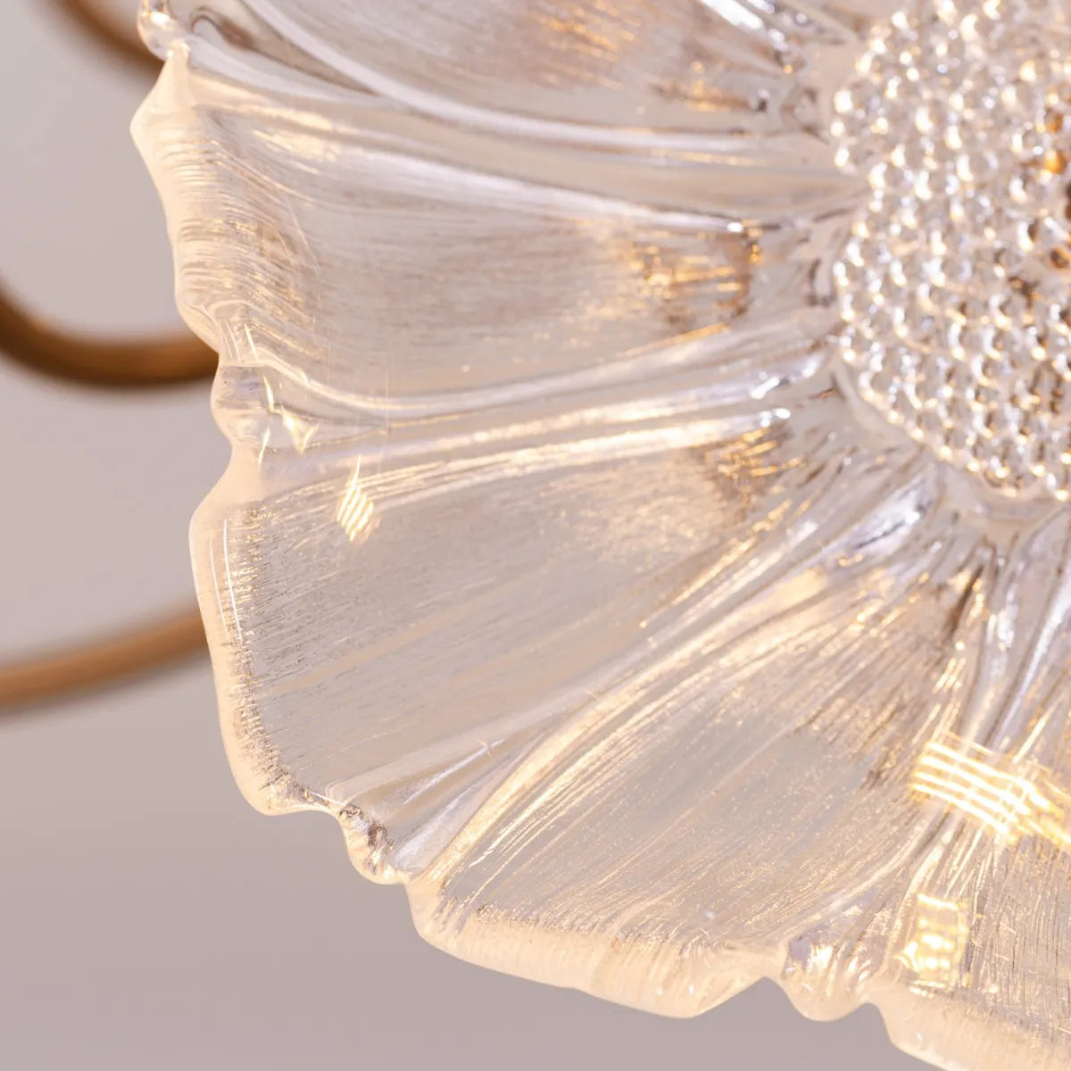 Late For Reality large gold chandelier with glass elements.