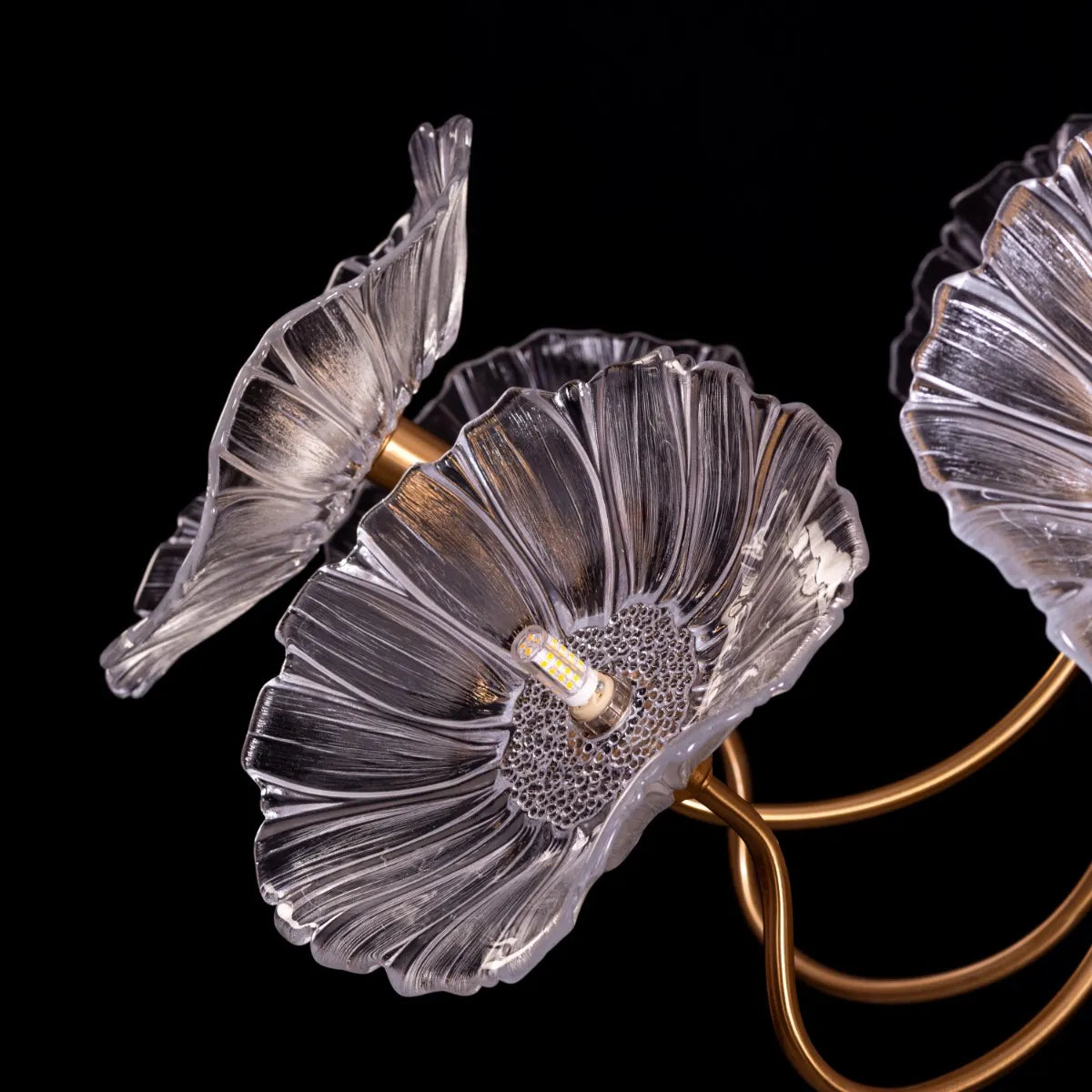 Late For Reality large gold chandelier with glass elements.