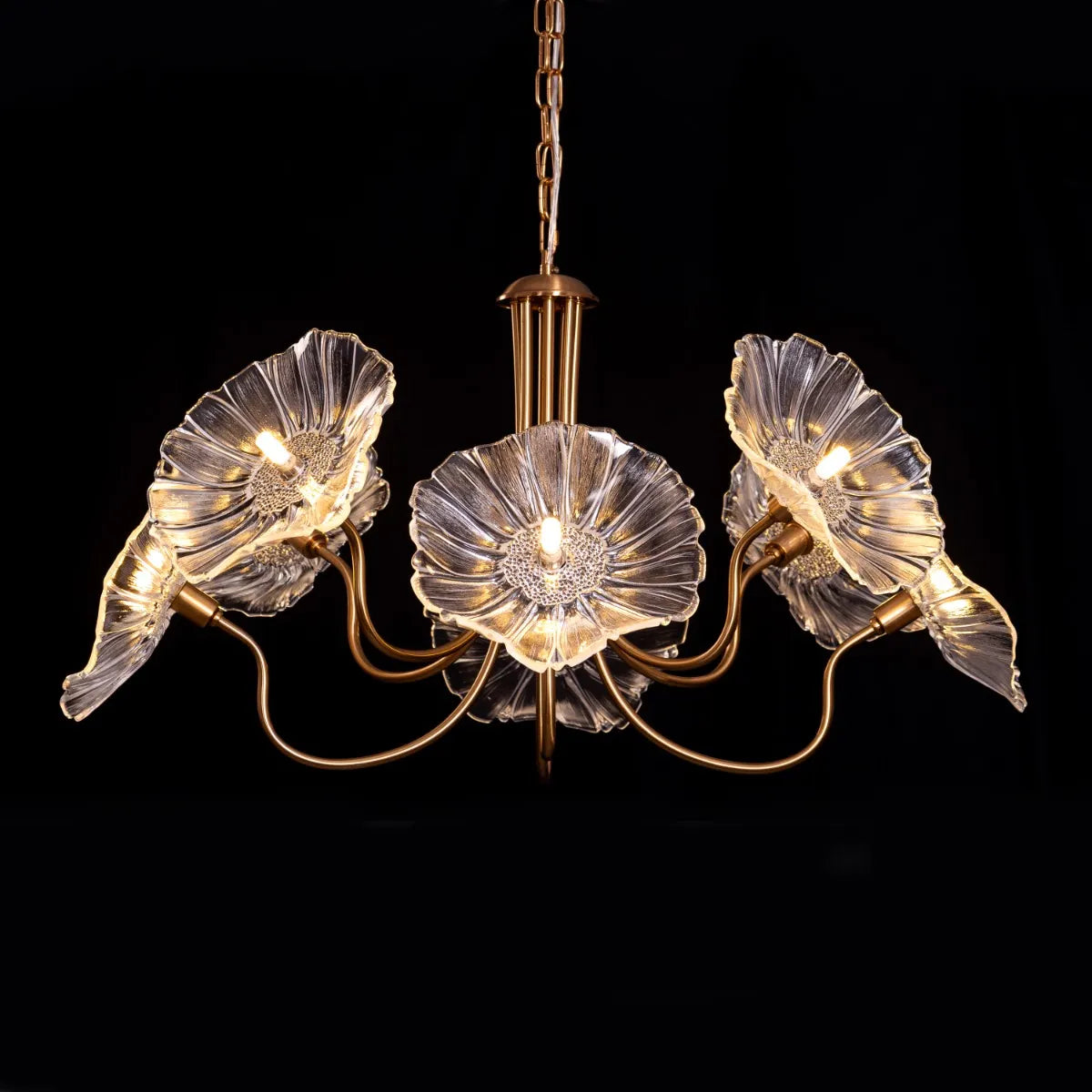 Late For Reality large gold chandelier with glass elements.