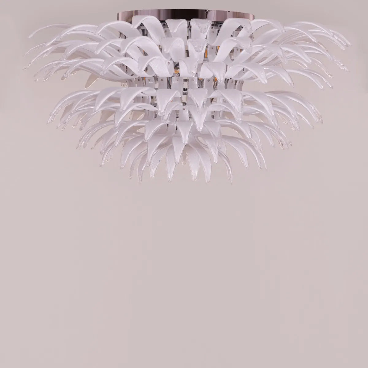 One More Try large chandelier with gold frame and white tinted glass panels illuminating a modern living room