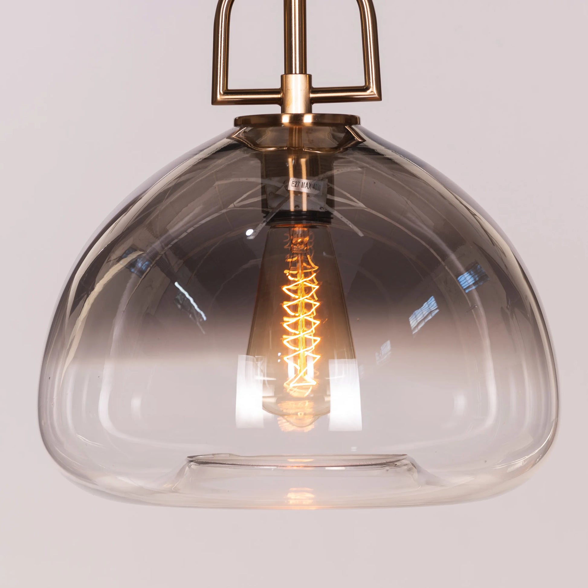 Stylish Nightlife Pendant Light in Clear Glass with Striking Gold and Smokey Grey Elements