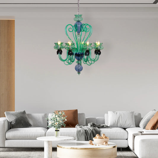 Kind To The Mind large green and blue clear glass chandelier illuminating a peaceful yoga studio