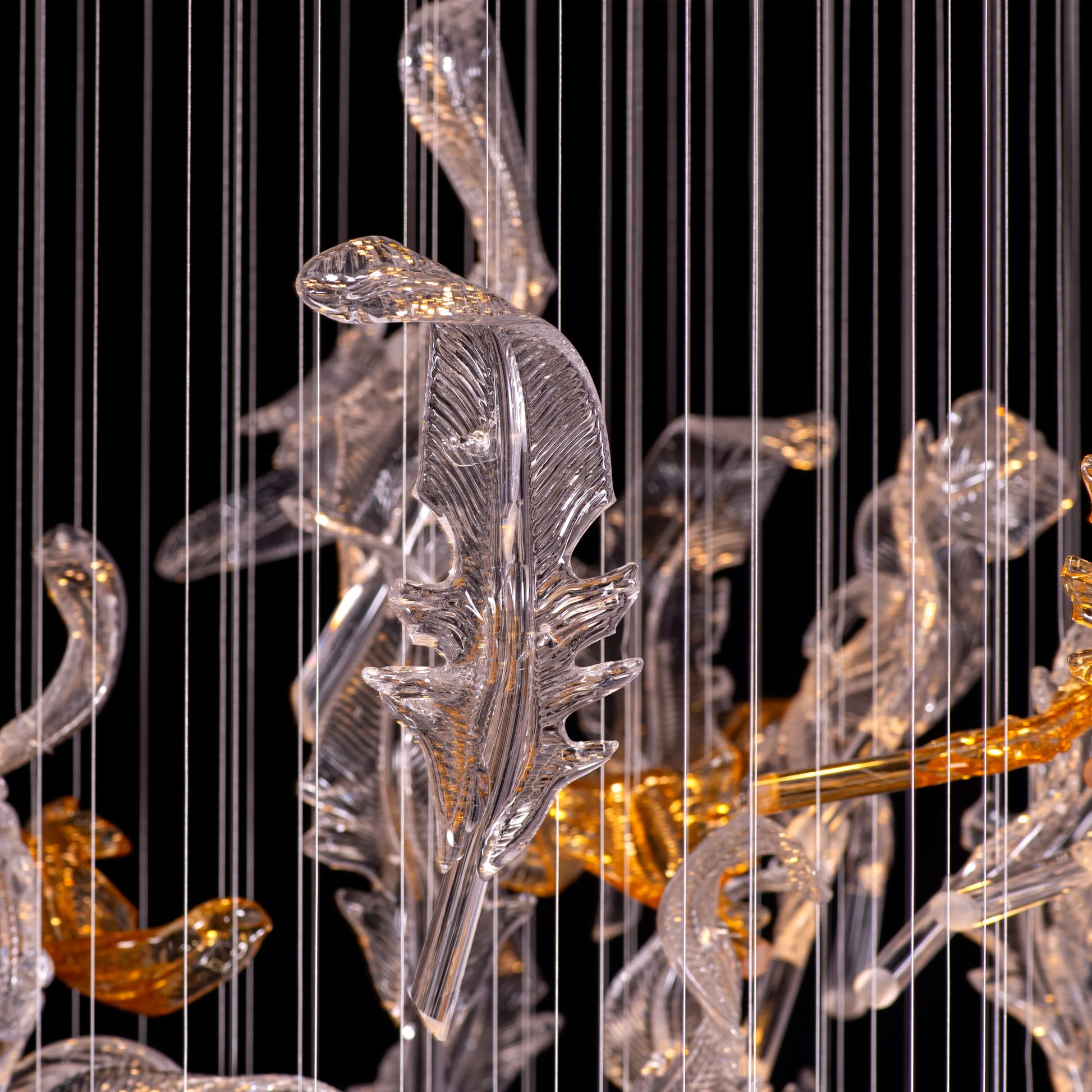 Sleek chrome and textured glass double-height chandelier with LED lighting