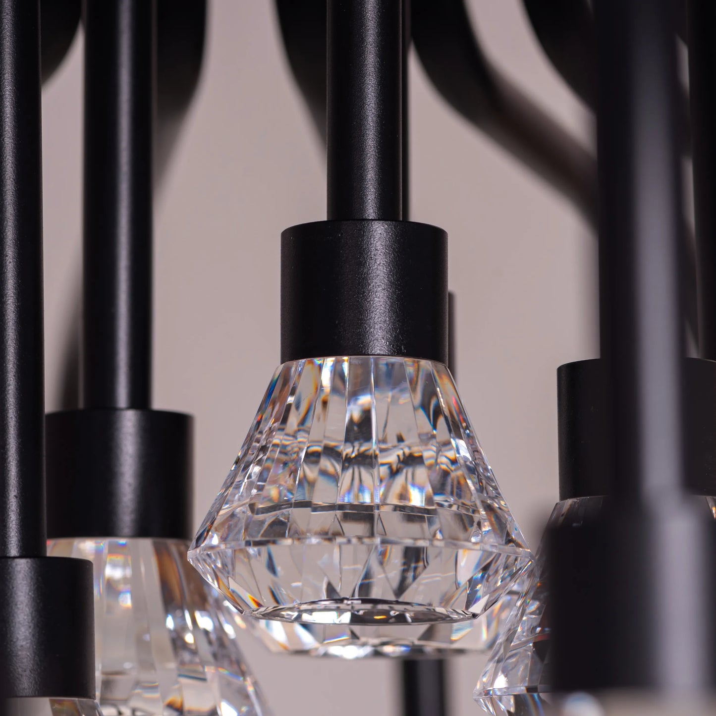 Queen Of Chaos black chandelier with built-in LED lighting.