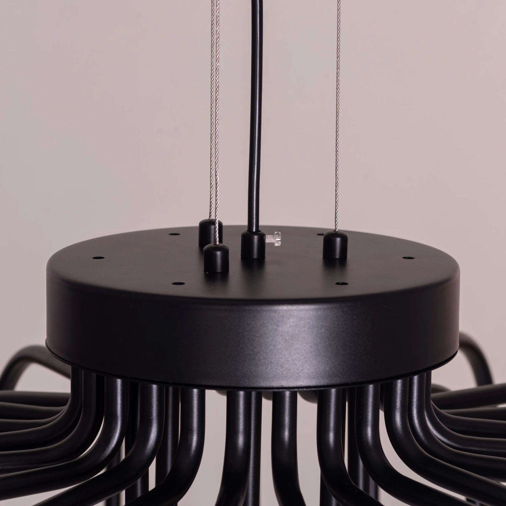 Queen Of Chaos black chandelier with built-in LED lighting.