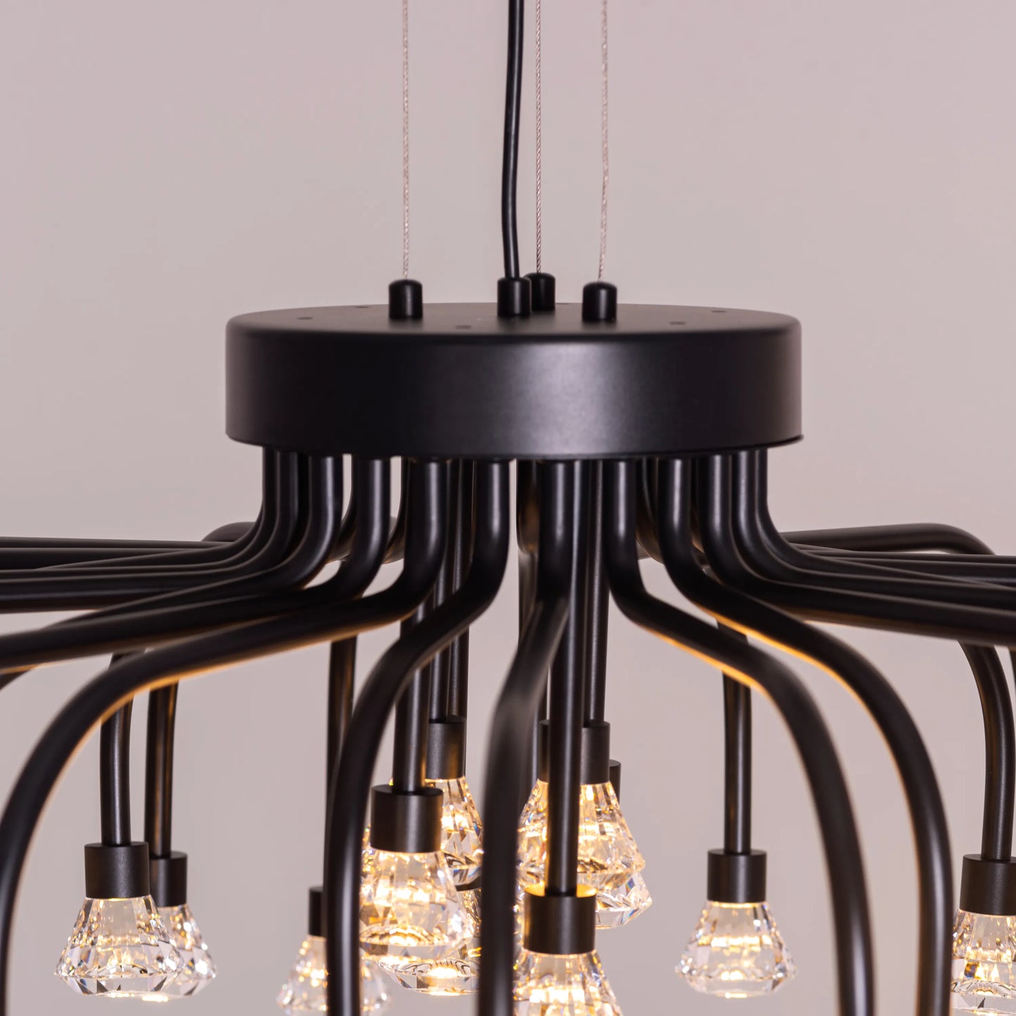 Queen Of Chaos black chandelier with built-in LED lighting.