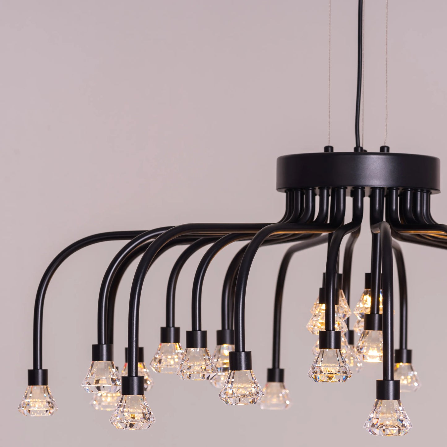 Queen Of Chaos black chandelier with built-in LED lighting.
