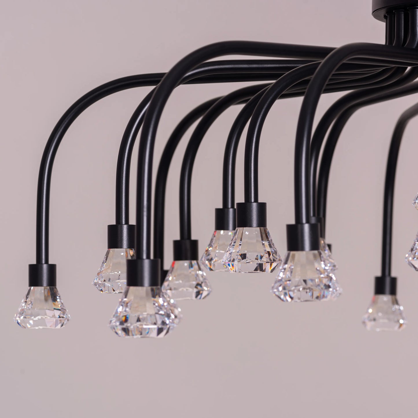 Queen Of Chaos black chandelier with built-in LED lighting.