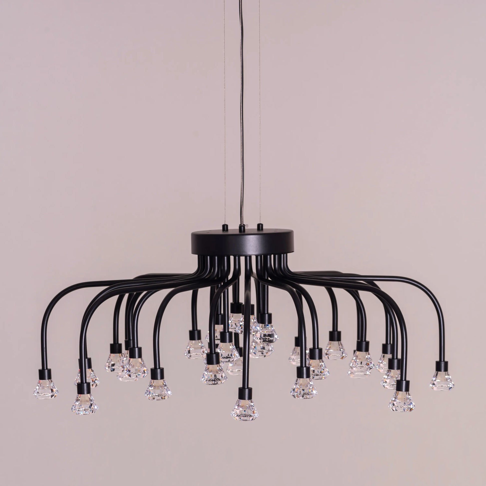 Queen Of Chaos black chandelier with built-in LED lighting.
