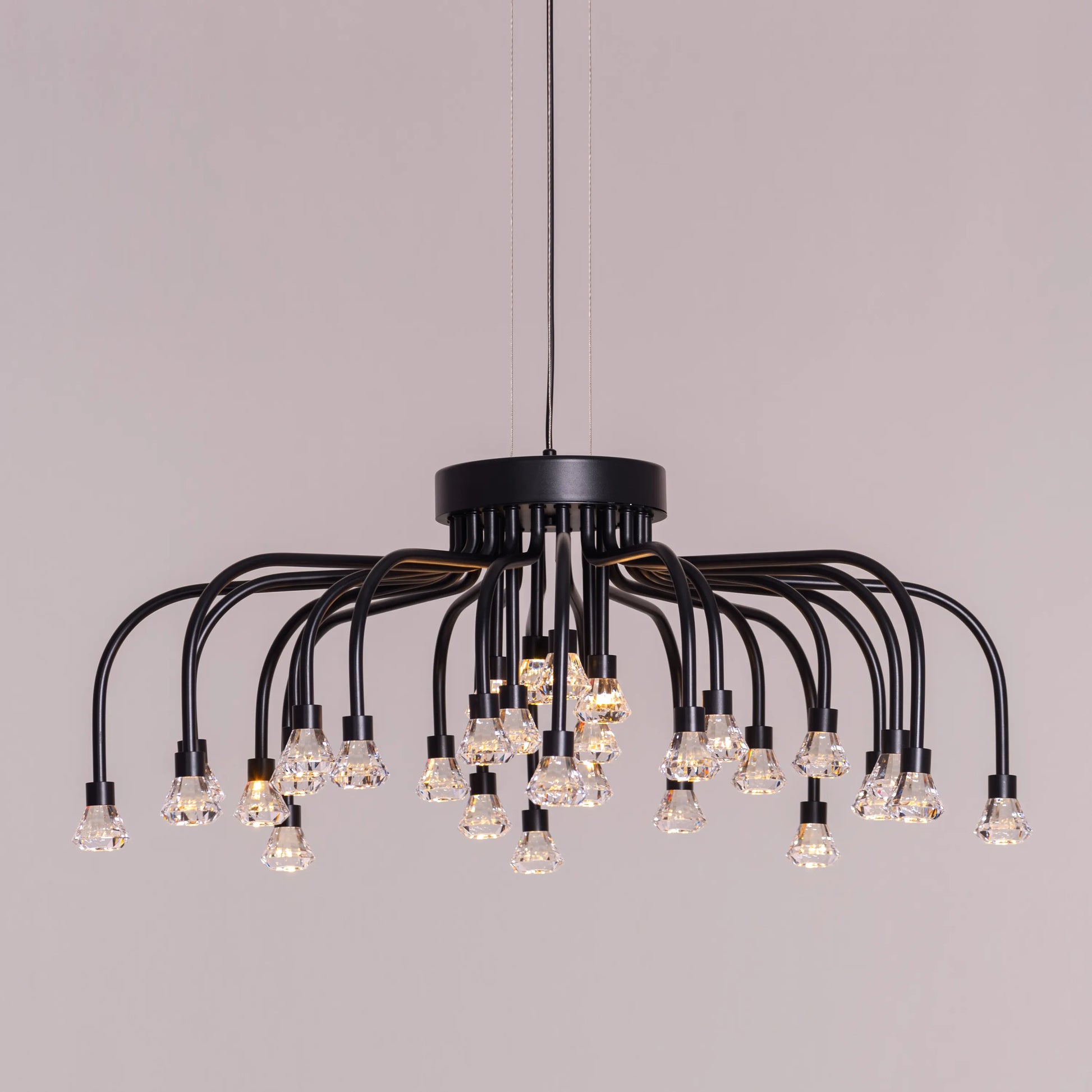 Queen Of Chaos black chandelier with built-in LED lighting.