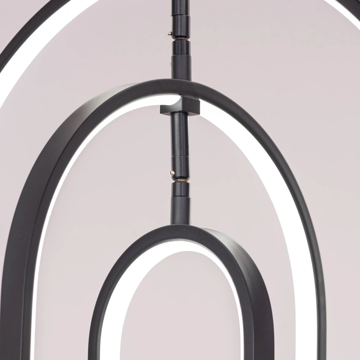 Heatwave Black Chandelier illuminating a room with vibrant amber light, showcasing its unique wave-inspired design