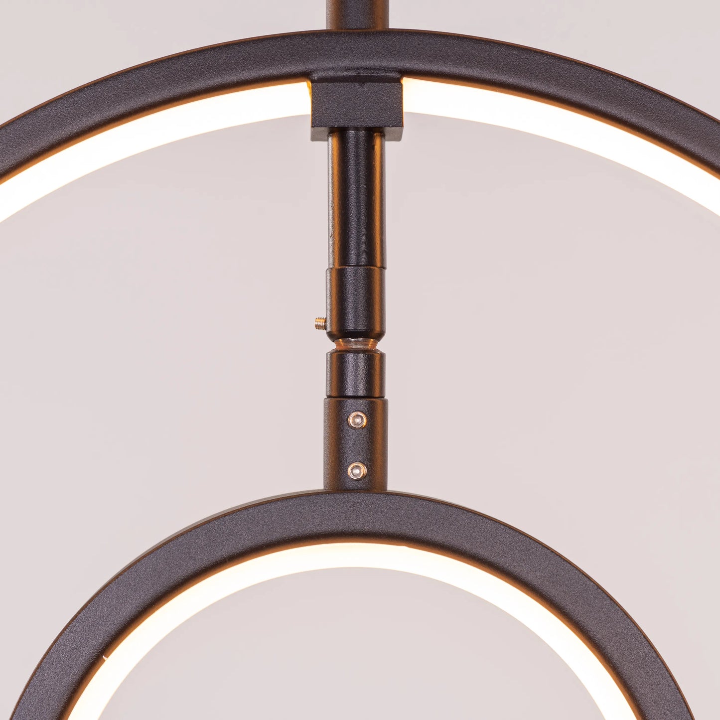 Heatwave Black Chandelier illuminating a room with vibrant amber light, showcasing its unique wave-inspired design